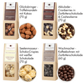 Vier Premium-Snacks im Geschenkset 'Best of Chocolate': Trüffelmandeln, Cranberries, Schoko-Crispies und Kaffeebohnen in Schokolade.