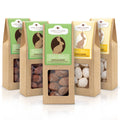 Osterbundle mit fünf Ostersnacks von Wellnuss. Enthält Mandeln in Vollmilchschokolade und Kakao, ideal für genussvolle Ostertage mit 10% Rabatt.