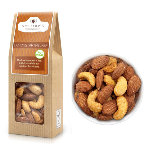 Durchstarthelfer Cashewkerne mit Chili & Salzmandeln mit leichter Rauchnote in 60 g Verpackung. Knackiger Energie-Snack für unterwegs, vegan & würzig.