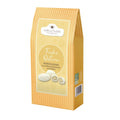 Maxi Faltschachtel Oster Kokosmandeln mit weißer Schokolade, 175g, stilvoll verpackt mit Osterdesign.
