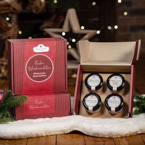 Geschenkkarton mit Lebkuchengewürz, Glühweingewürz, Chai Tee und Haselnusskerne mit Vollmilchschokolade & Zimt - wellnuss Premium Präsente