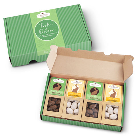 Offener Geschenkkarton mit 4 Ostersnacks, edle Schokoladenmandeln in verschiedenen Sorten, verpackt in stilvoller Osterbox mit grünem Design.